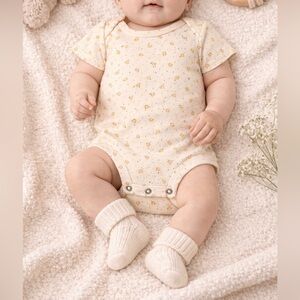 Cream Baby Onesie with Yellow Accents